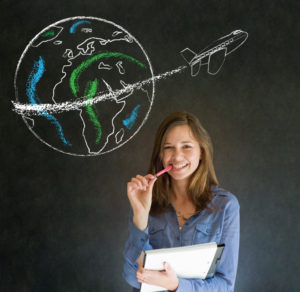 Woman with chalk  globe and jet world travel