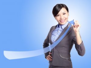 17078945 - success business woman draw arrow with blue background, asian model