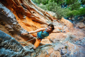 37602986 - female rock climber climbs on a rocky wall