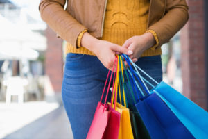 45535742 - woman holding shopping bags at a boutique